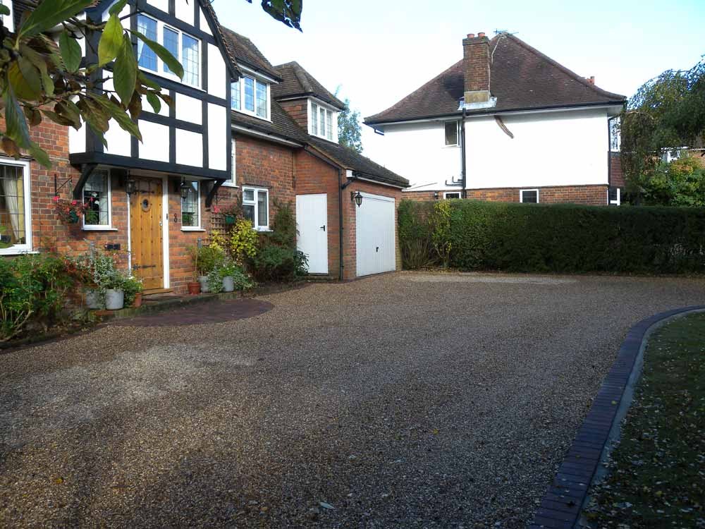 The finished gravel drive in front of the house