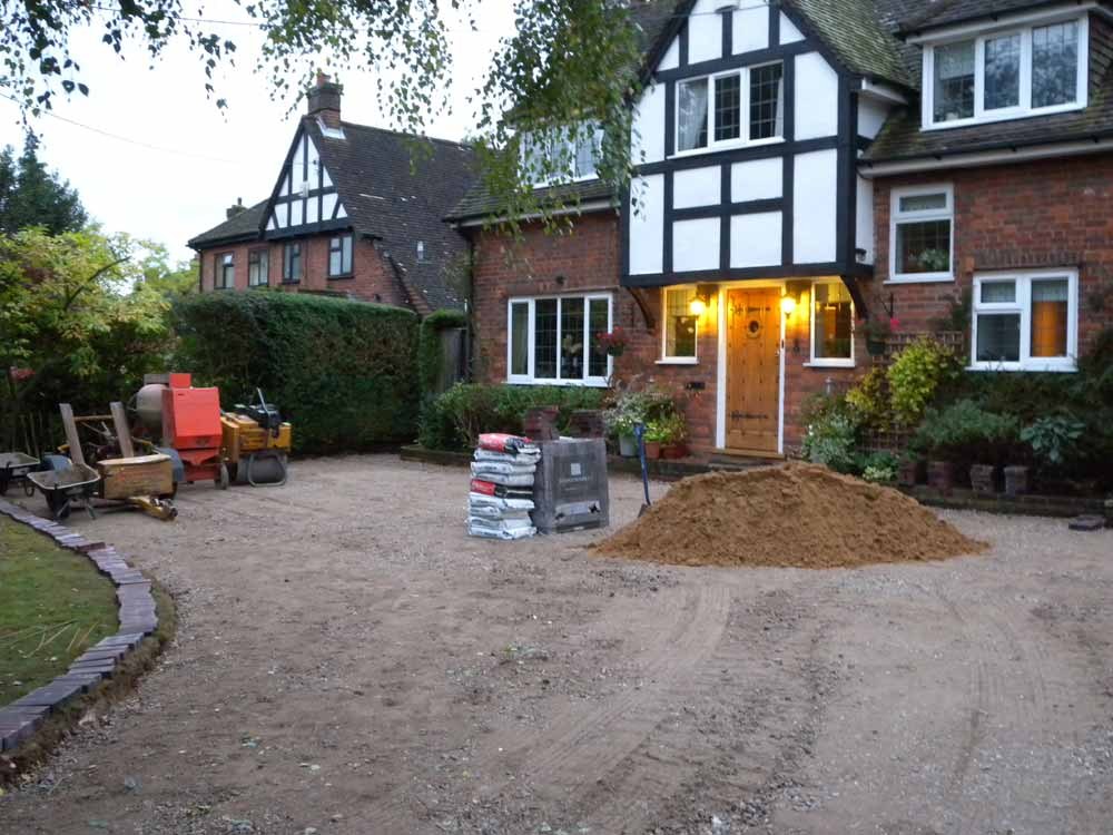 The drive prepared, with a pile of sand ready